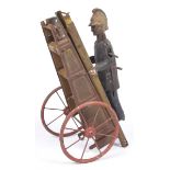 A Gama tinplate clockwork fireman With extending ladder, height 26cm