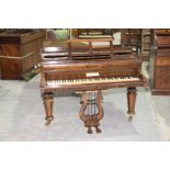 A late 19th/early 20th Century rosewood grand piano, by John Broadwood & Sons. London The rosewood