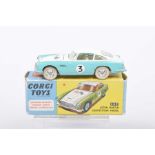 A boxed Corgi Toys no. 309 Aston Martin 'Competition Model' Two-tone white and turquoise, with lemon