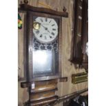 A Victorian inlaid walnut wall clock by J W Hughes Llanelly The inlaid and glazed door enclosing a