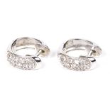 A pair of 18ct gold diamond hoop earrings Each designed as a brilliant cut diamond hinged hoop,