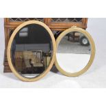 Two Regency style gilt framed wall mirrors Each with a bevelled plate within a ribbon tied reeded