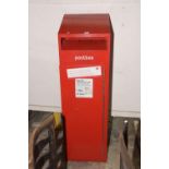 A 20th Century floor standing postbox The red letterbox with sloping top and letter aperture above a