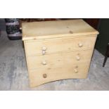 A Victorian pine chest of drawers With an arrangement of three graduated drawers each applied with