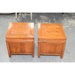 A pair of Chinese hardwood box lamp tables, 20th Century Each of cubic form with a hinged top,