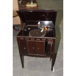 An early 20th Century mahogany cased gramophone cabinet by Apollo Having a hinged caddy top