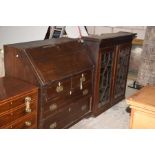 An 18th Century oak bureau bookcase Having a moulded cornice above two astragal glazed doors, the