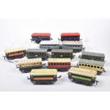 Fourteen unboxed French Hornby '0' gauge coaches In various French liveries, including Est, SNCF,