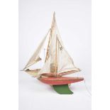 Two wooden Star pond yachts One with white hull and plank effect decking, with single mast, the