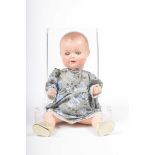 A German bisque headed 'My Dream Baby' style doll With moulded hair, open/shut blue eyes, open