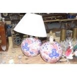 A pair of Chinese ceramic lamp bases The bulbous form bases with all over pink and blue floral