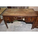 A Georgian style mahogany desk, 20th Century The rectangular top above a single frieze drawer