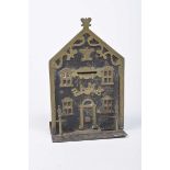 A brass and iron money box, 20th Century The money box in the form of a bank with brass applied