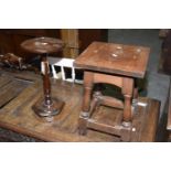 A late 19th early 20th Century mahogany wine table or urn stand Having a circular top upon a slender