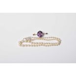 An amethyst brooch The oval shape amethyst atop the bar brooch stamped 9ct, together with a cultured