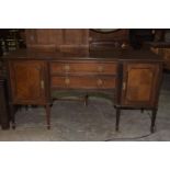 A Georgian style mahogany inverted breakfront sideboard, early 20th Century The moulded top above