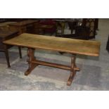 A mid 20th Century oak refectory table The rectangular slab top raised upon two trestle type