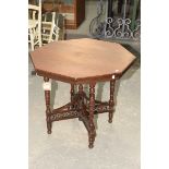 A Victorian walnut octagonal occasional table Raised upon ring incised tapering legs with a