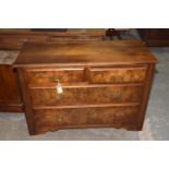 A late Victorian walnut chest of drawers Having an arrangement of two short and two long drawers