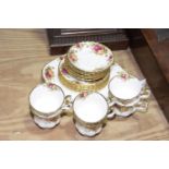 A part Royal Albert 'Old Country Roses' tea service To include six teacups and matching saucers,