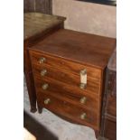 A George IV mahogany commode chest The folding top above an arrangement of four faux drawers each