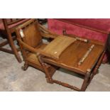 An early 20th Century oak child's metamorphic chair by Hitchins of Liverpool The chair with a