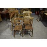 Two Victorian lath back elm and beech Windsor farmhouse elbow chairs Each with a lath back above a