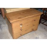 A Victorian pine chest of drawers The rectangular top with an overhanging cornice above three long
