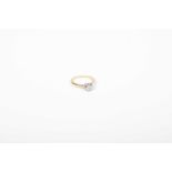 A diamond single stone ring The brilliant cut diamond within a collet setting, stamped 18ct,