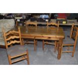 A pine farmhouse kitchen table The rectangular table top with rounded corners raised upon ringed