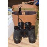 A cased set of R.E.L Canadian binoculars The Canadian binoculars with leather strap, C.G.B40M.A.7x50