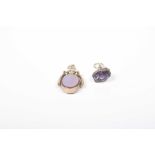 Two 9ct gold gem-set fobs To include an amethyst fob together with a hardstone spinner fob, total