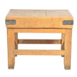 An early 20th Century pine and beech wood butchers block The substantial block applied with iron