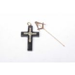 A Masonic stick pin The Masonic emblem atop the stick pin, stamped 9ct, Together with a cross