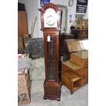 A reproduction Georgian style mahogany cased long case clock, 20th Century The arched hood above a