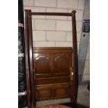 A pair of oak panelled single beds, 20th Century Each bed with a twin fielded panelled headboard and