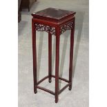 A Chinese rosewood jardiniere stand, 20th Century Having a square top above a scrolling dragon