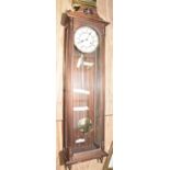 A walnut cased German Vienna style wall clock, 20th Century Having a pediment and turned finials