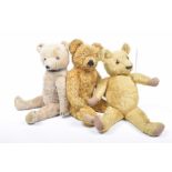 Three plush teddy bears Comprising a gold plush Merrythought bear with glass eyes and articulated