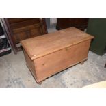 A Victorian pine blanket chest The rectangular hinged top enclosing a fitted candle box above two