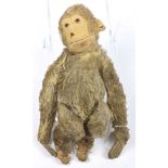 A Steiff brown plush monkey With glass eyes, felt face, ears, hands and feet, with pin to left