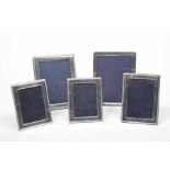 Five silver picture frames Of varying sizes, some with decorative surround, Carr's of Sheffield