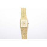 A Zeon quartz wristwatch The rectangular shape gold tone dial with baton hour markers, signed