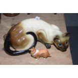 A ceramic figure of a Burmese cat The cat modeled in pouncing position, length 36cm, together with a