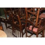 A set of six early 20th Century Sheraton Revival dining chairs The mahogany chairs with reeded