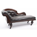 A small doll's reproduction chaise longue On castors with black leatherette seat, length 68cm.