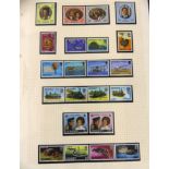 A stamp album containing mint Jersey stamps A quantity of loose pages containing used Commonwealth