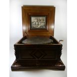 A Polyphon music box of large proportions The rectangular walnut and inlaid hinged case decorated