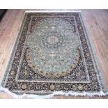 A Keshan carpet Decorated with floral design on a dark blue background, 2.8x2.0m