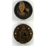 Two late 19th/early 20th Century Continental figural terracotta wall plaques One formed with an